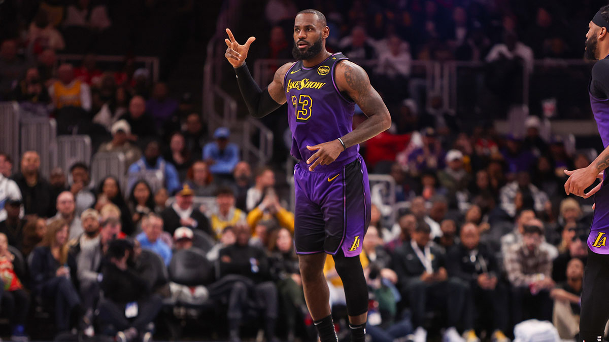 Los Angeles Lakers forward LeBron James (23) reacts after a three point basket against the Atlanta Hawks in the first quarter at State Farm Arena. 