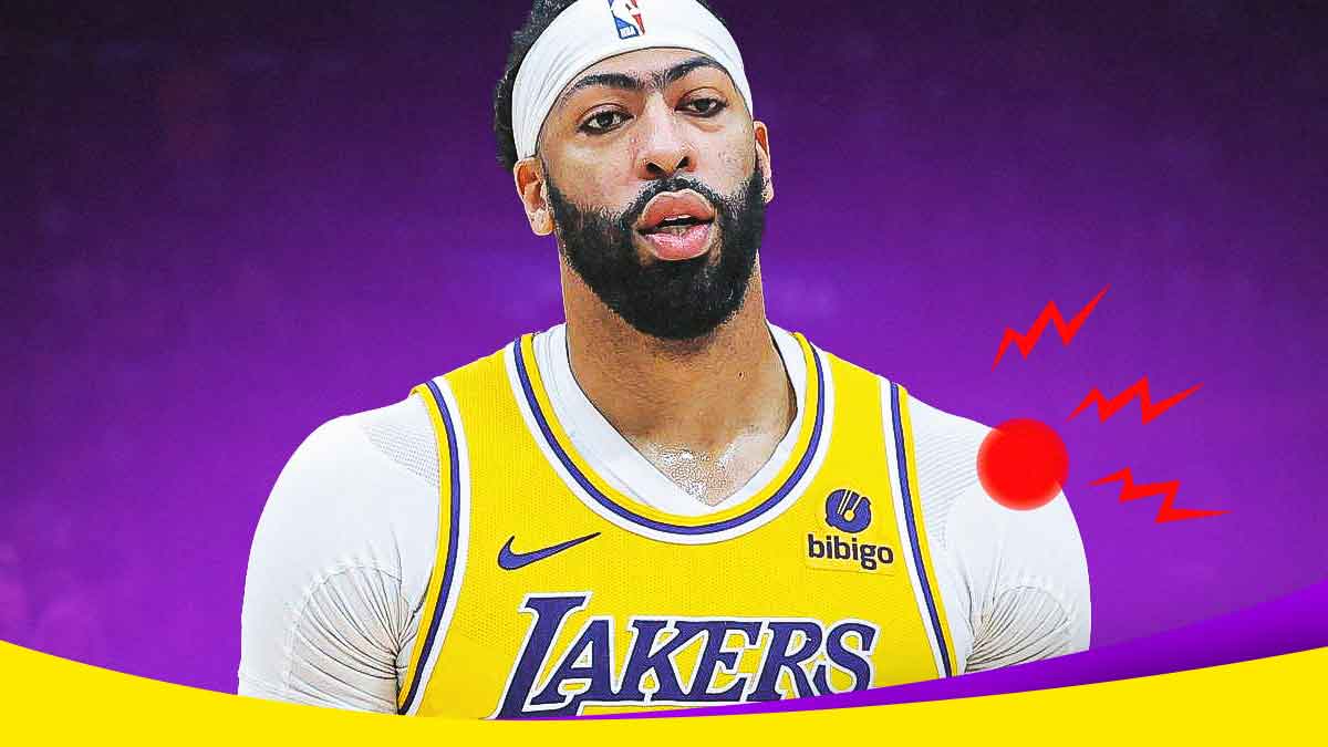 Anthony Davis (Lakers) looking serious with pain symbol on left shoulder
