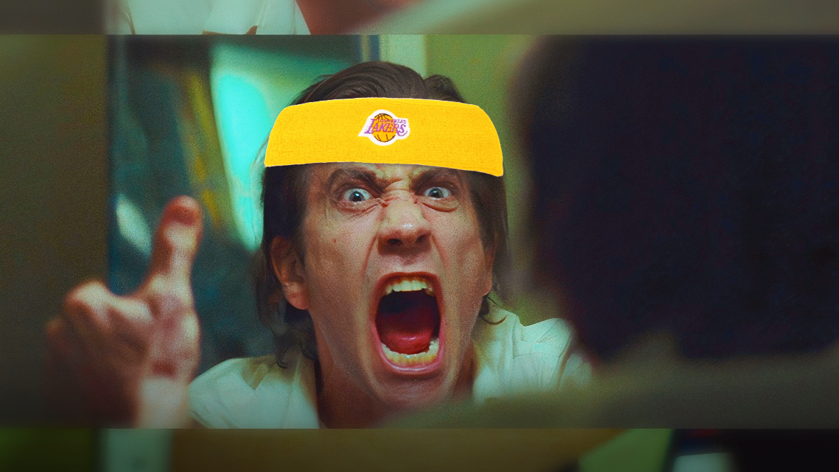 Jake Gyllenhaal shouting at the mirror and wearing a Lakers headband/cap