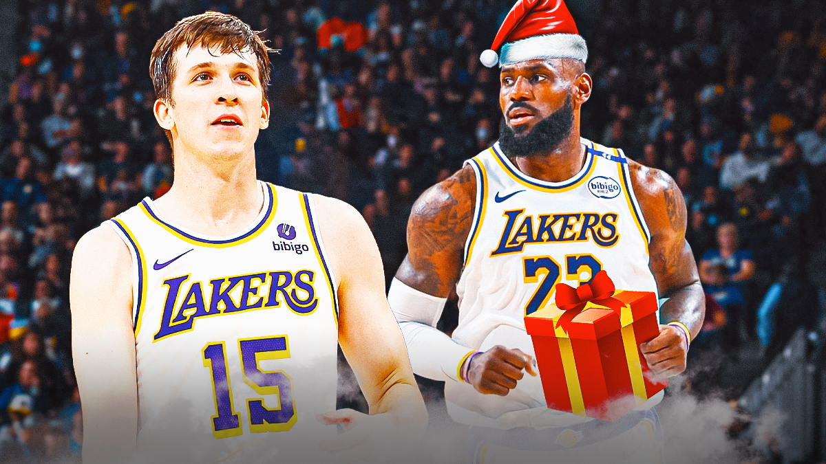 Lakers' Austin Reaves smiling, with LeBron James as Santa Claus giving him a gift beside him