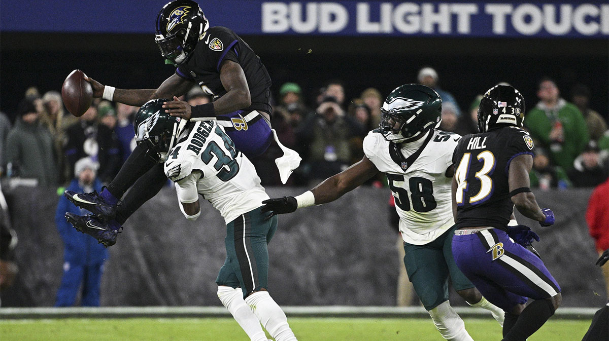 Lamar Jackson leaping over Isiah Rodgers during the Ravens-Eagles game.