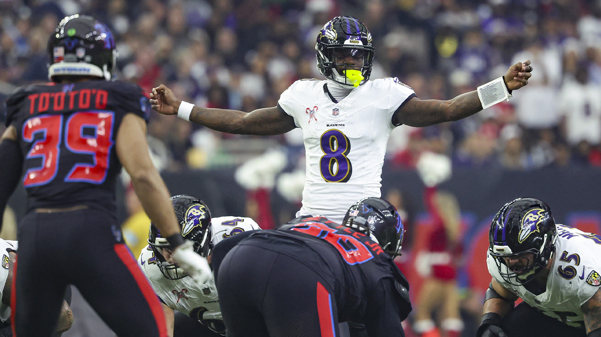 Dec 15, 2024; Houston, Texas, USA; Baltimore Ravens quarterback Lamar Jackson (8) at the line of scrimmage during the first quarter against the Houston Texans at NRG Stadium. 