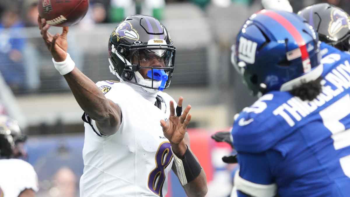 Baltimore Ravens quarterback Lamar Jackson (8) throws against the New York Giants during the first quarter at MetLife Stadium.