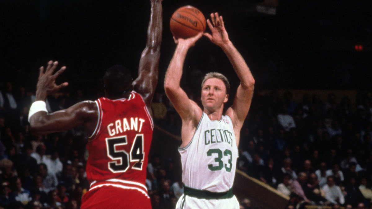 Boston Celtics forward Larry Bird (33) shoots over Chicago Bulls forward Horace Grant (54) at the Boston Garden.