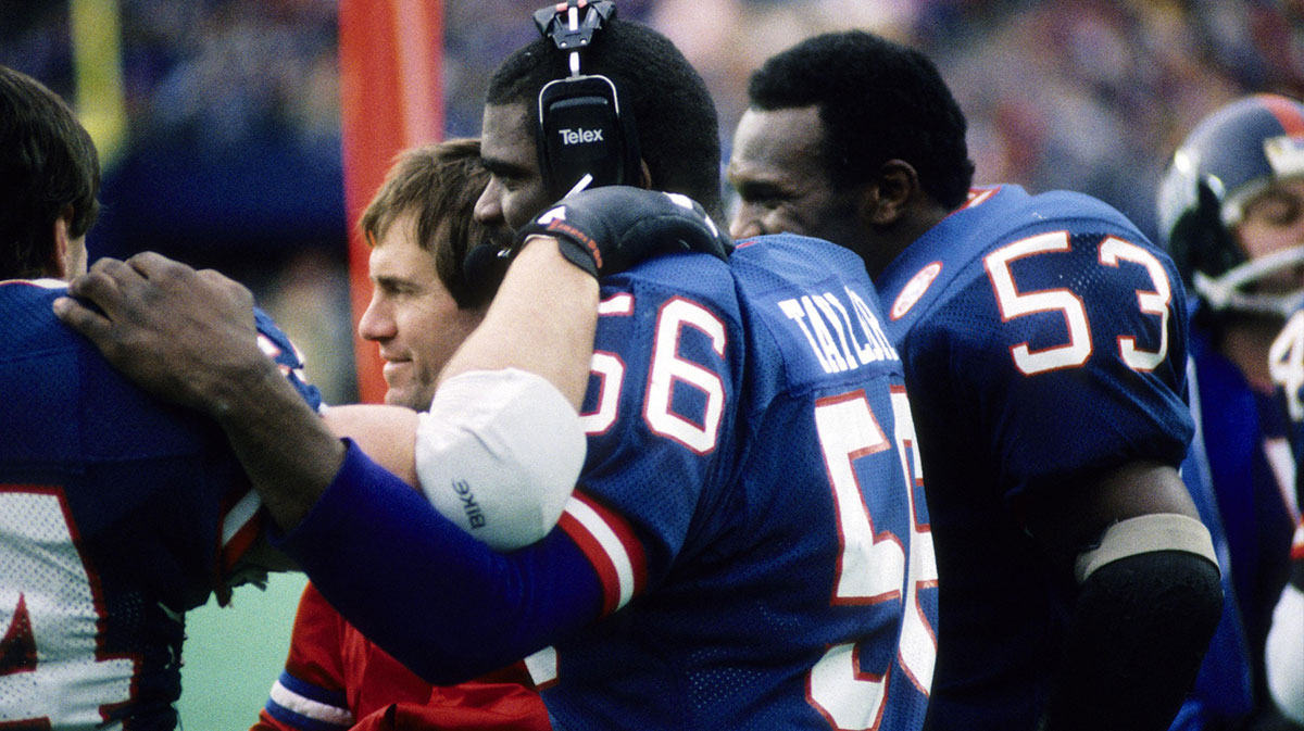 New York Giants linebacker Lawrence Taylor (56) and Harry Carson (53) on the sideline with assistant coach Bill Belichick during the 1986 NFC Divisional Playoff Game at Giants Stadium