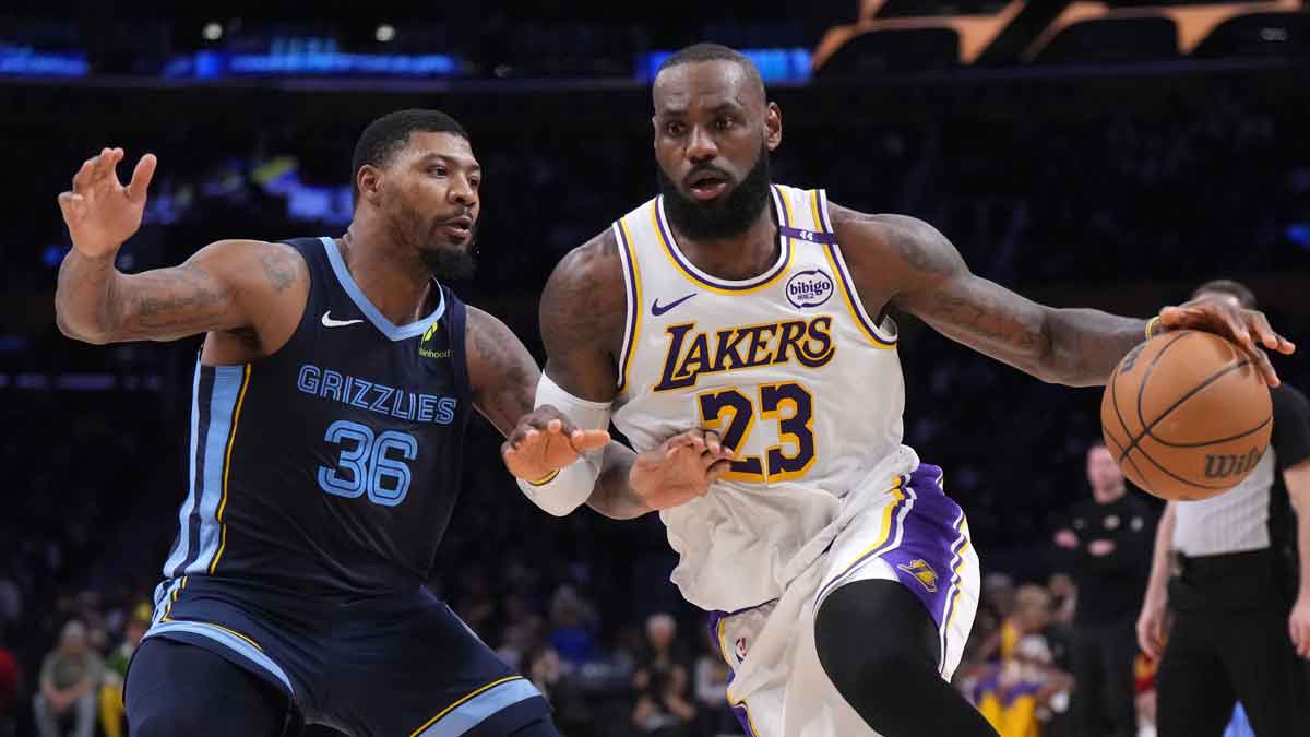 Los Angeles Lakers forward LeBron James (23) dribbles the ball against Memphis Grizzlies guard Marcus Smart (36) at Crypto.com Arena.
