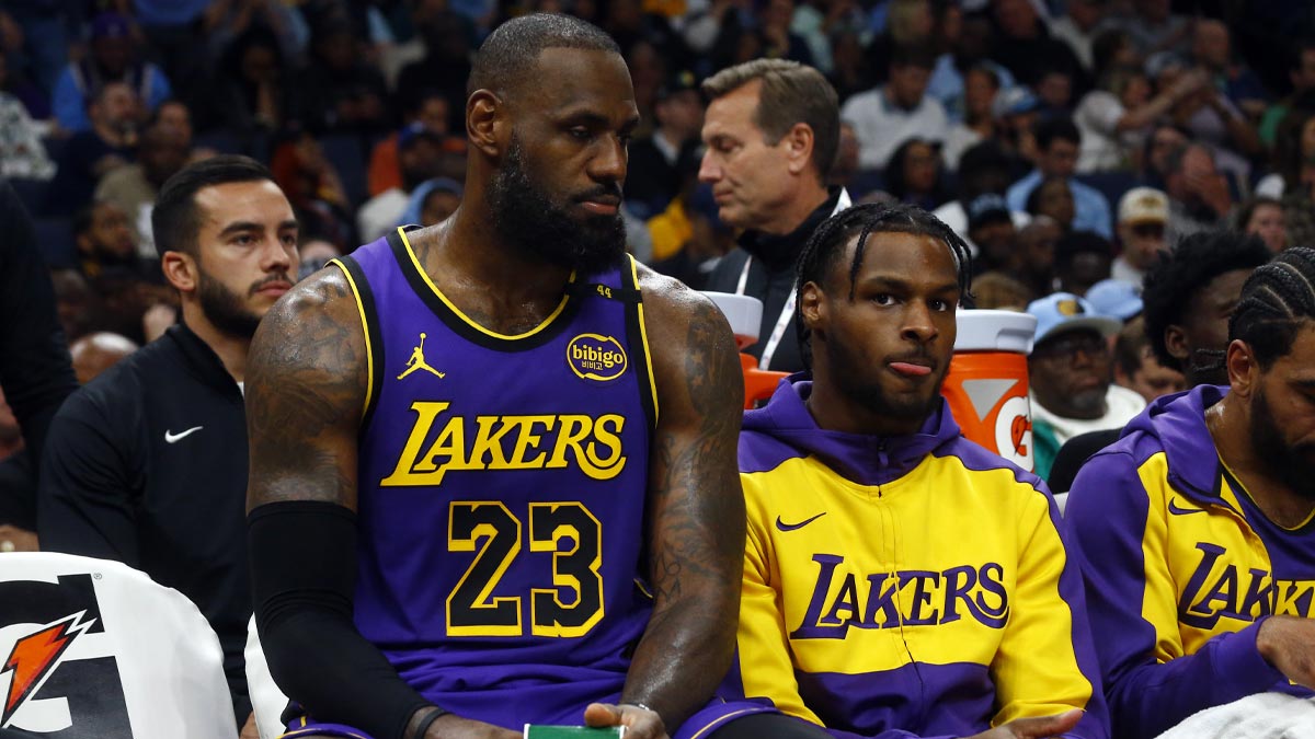 Los Angeles Lakers forward LeBron James (23) and Los Angeles Lakers guard Bronny James (9) sit on the bench during the first half against the Memphis Grizzlies at FedExForum.