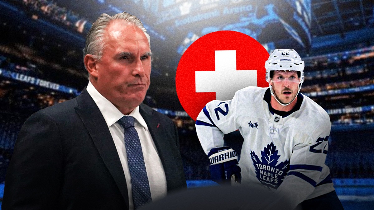 Maple Leafs defenseman Jake McCabe and coach Craig Berube, with a red medical cross