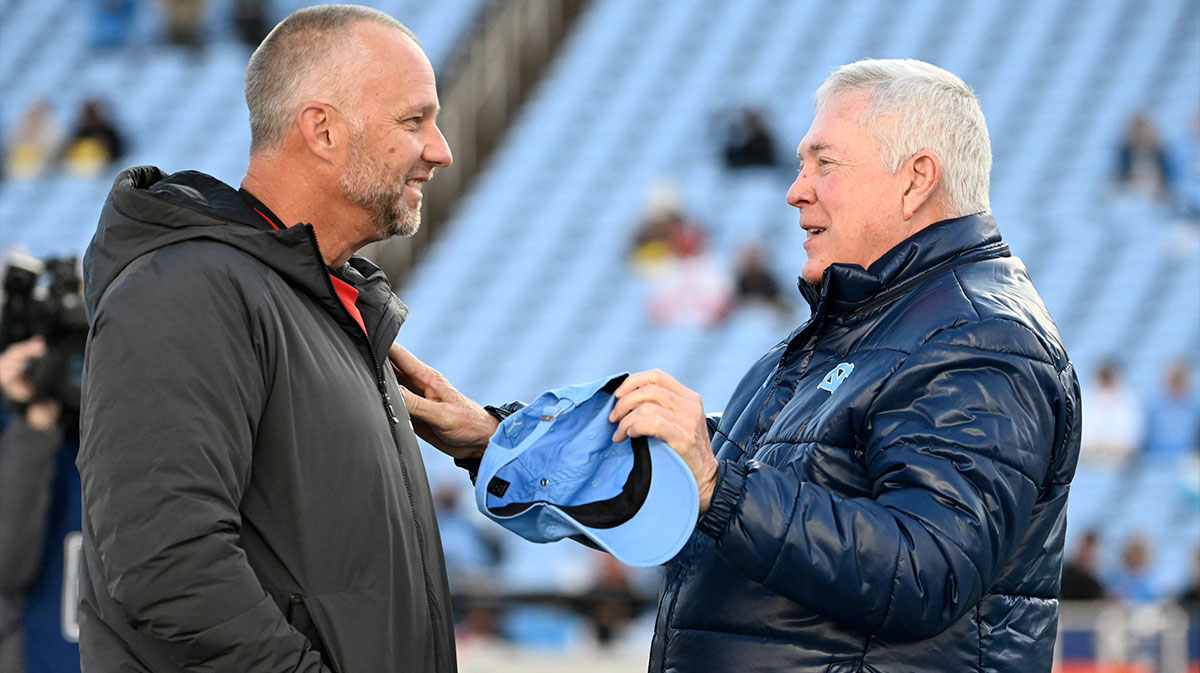 North Carolina State Wolfpack head coach Dave Doeren with North Carolina Tar Heels head coach Mack Brown before the game at Kenan Memorial Stadium.