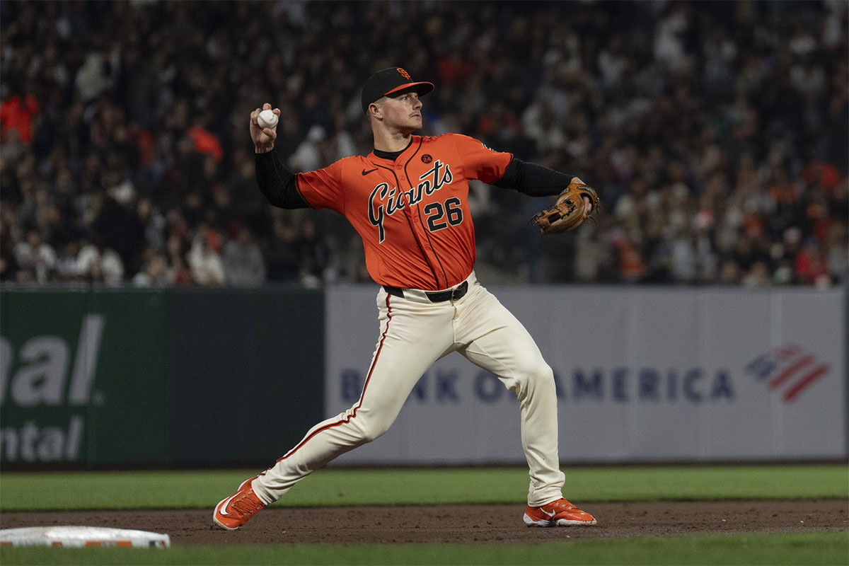 San Francisco Giants third base Matt Chapman (26) throws the ball during the fourth inning against the San Diego Padres at Oracle Park