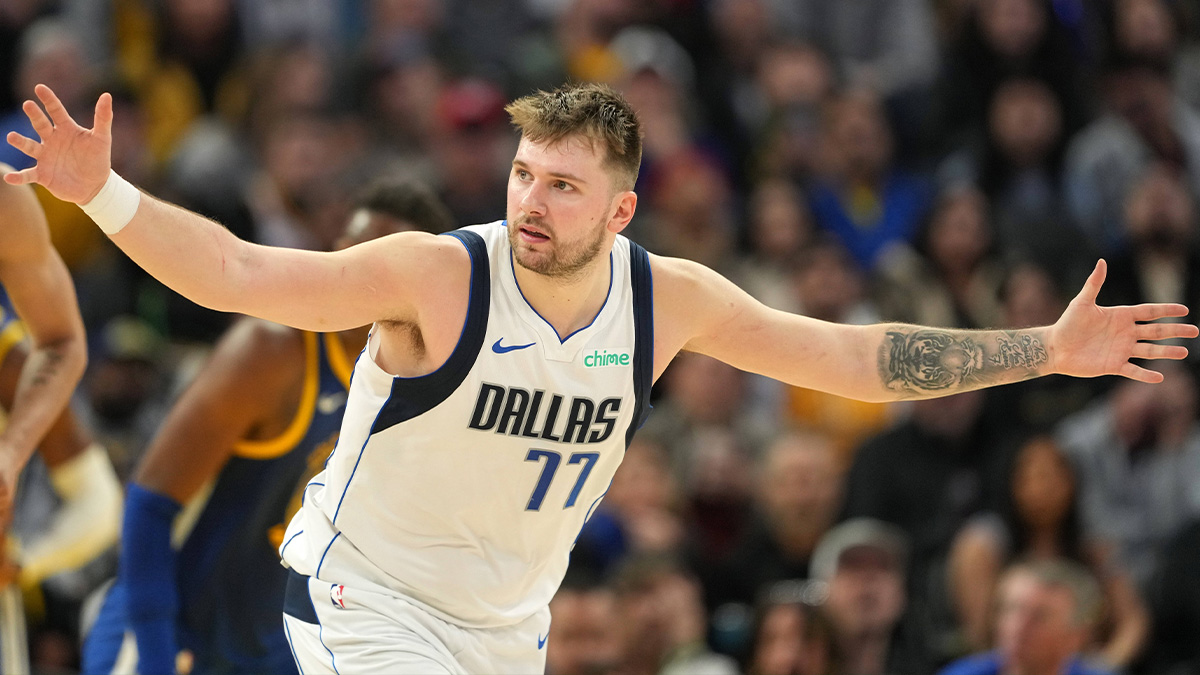 Dallas Mavericks guard Luka Doncic (77) gestures after scoring against the Golden State Warriors during the fourth quarter at Chase Center. Mandatory Credit: Darren Yamashita-Imagn Images