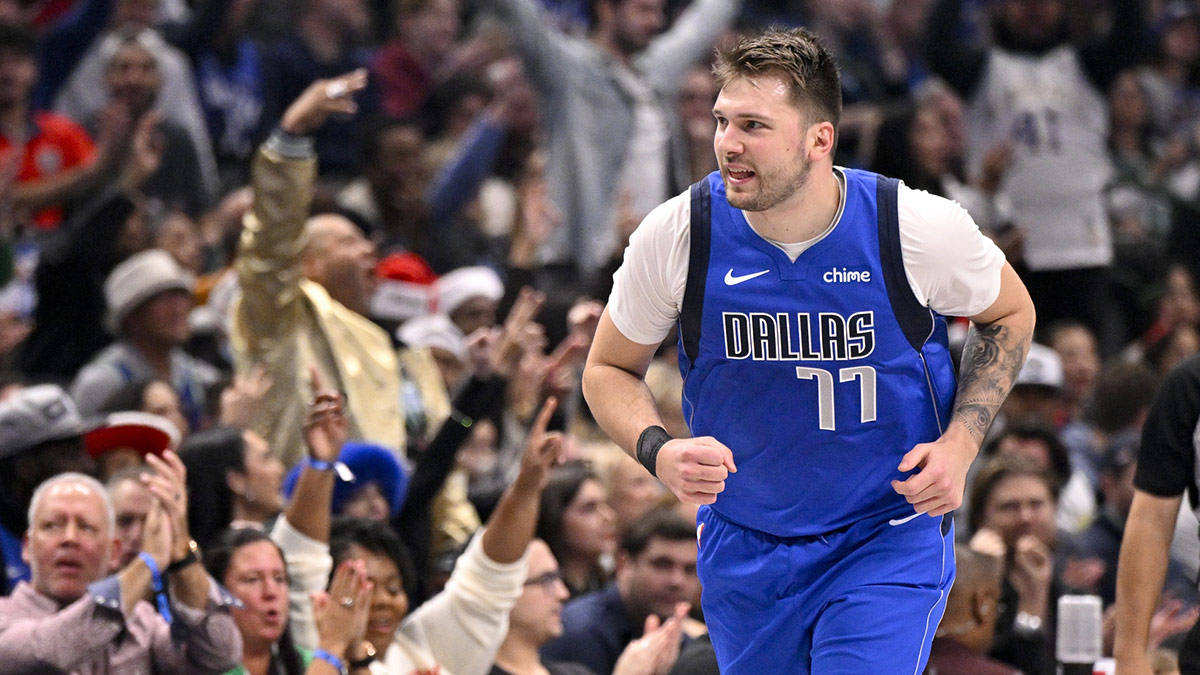 Mavericks Guard Luka Doncic (77) celebrates after making baskets against Minnesota Timbervolves during the first quarter in the center of America Airlines