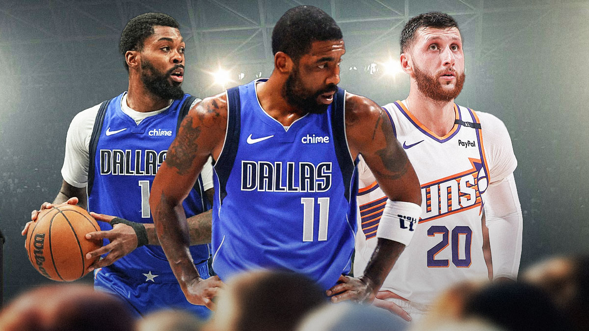 Dallas Mavericks star Kyrie Irving in the middle of Naji Marshall and Jusuf Nurkic in front of Footprint Center.