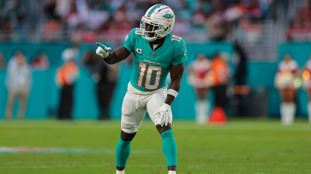 Miami Dolphins wide receiver Tyreek Hill (10) signals from the line of scrimmage against the San Francisco 49ers during the second quarter at Hard Rock Stadium.