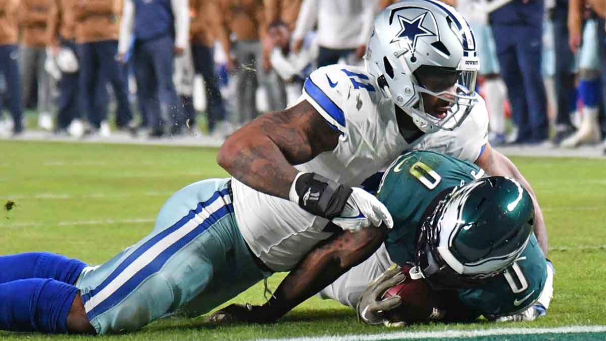 Dallas Cowboys linebacker Micah Parsons (11) stops Philadelphia Eagles running back D'Andre Swift (0) short of the goal line during the second quarter at Lincoln Financial Field. 