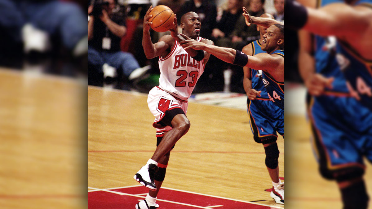 Chicago Bulls Guards Michael Jordan (23), left, moves to the basket in front of Detroit Pistons Player Rick Mahorn (44), in Juttoict Center.