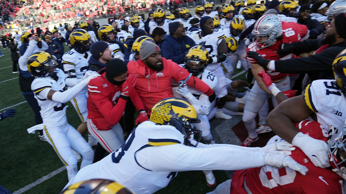 Michigan Wolverines defensive lineman Kenneth Grant (78) goes after Ohio State Buckeyes safety Jaylen McClain (18) after the game during a fight at the middle of the field after the NCAA football game at Ohio Stadium in Columbus on Saturday, Nov. 30, 2024.