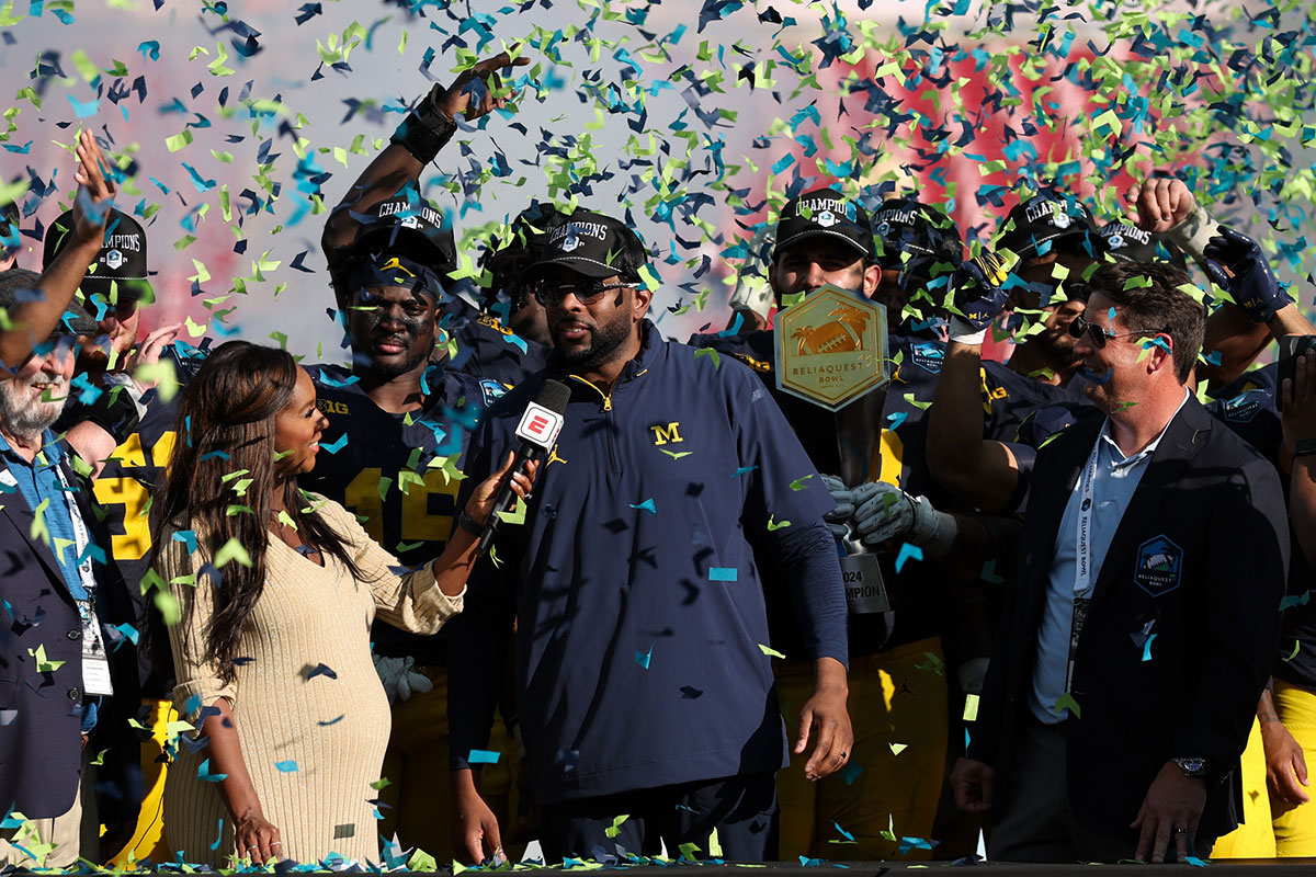 Michigan Wolverines head coach Sherrone Moore celebrates after beating the Alabama Crimson Tide in the ReliaQuest Bowl at Raymond James Stadium.
