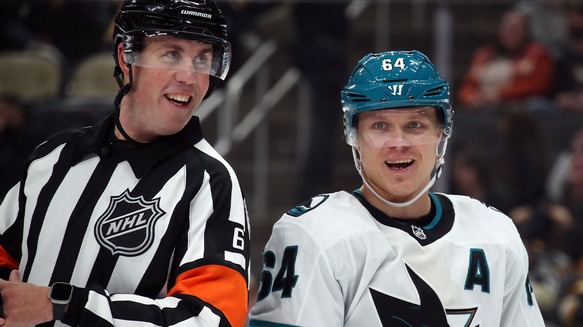 NHl referee Francis Charron (6) and San Jose Sharks center Mikael Granlund (64) talk on the ice against the Pittsburgh Penguins during the third period at PPG Paints Arena.