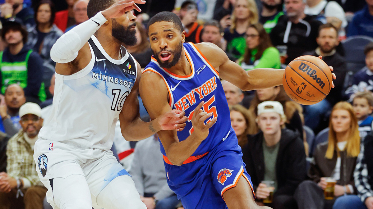 New York Knicks forward Mikal Bridges (25) battles Mike Conley (10) to the paint in the first quarter at Target Center.