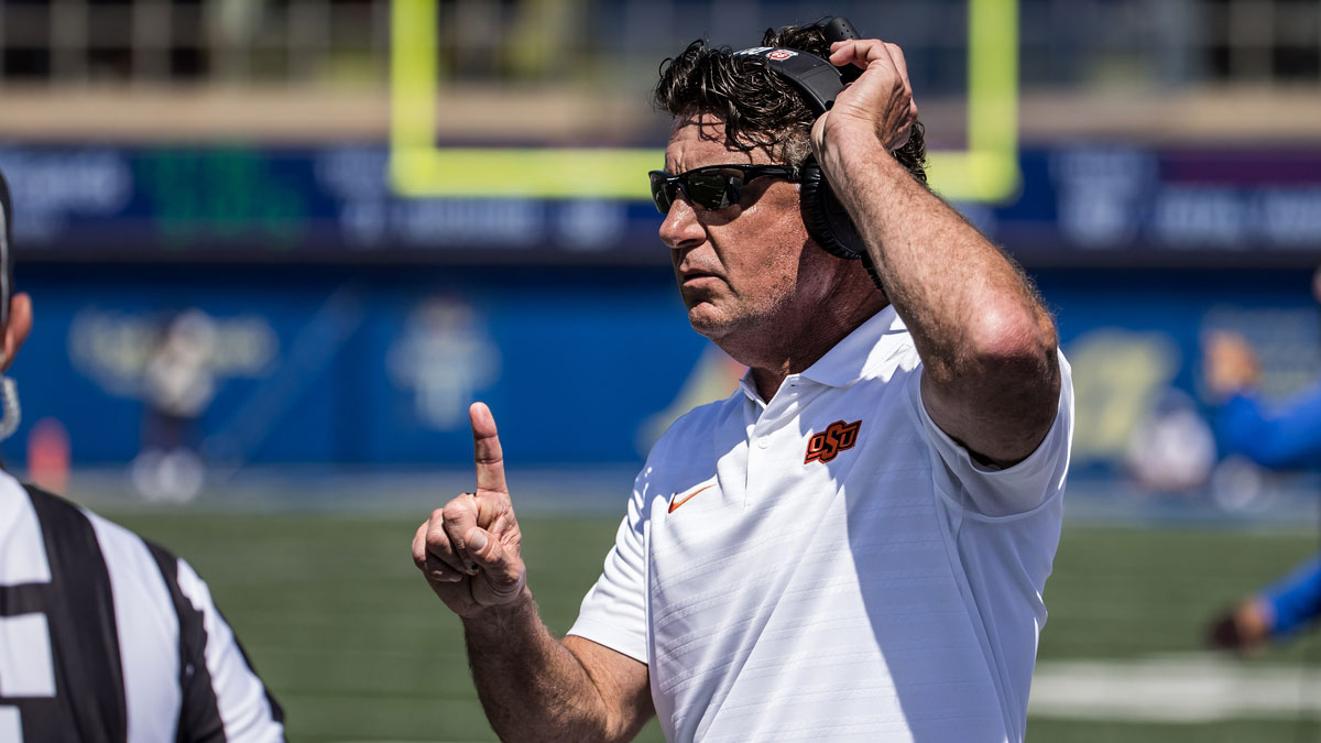 Oklahoma State Cowboys head coach Mike Gundy talks to an official during the second quarter against the Tulsa Golden Hurricane at Skelly Field at H.A. Chapman Stadium.