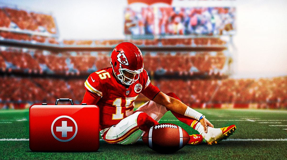 Patrick Mahomes grabs his ankle in pain