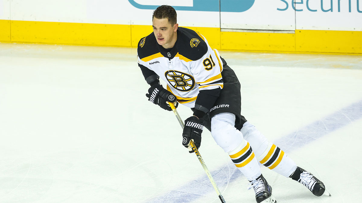 Boston Bruins defenseman Nikita Zadorov (91) skates with the puck during the warmup period against the Calgary Flames at Scotiabank Saddledome