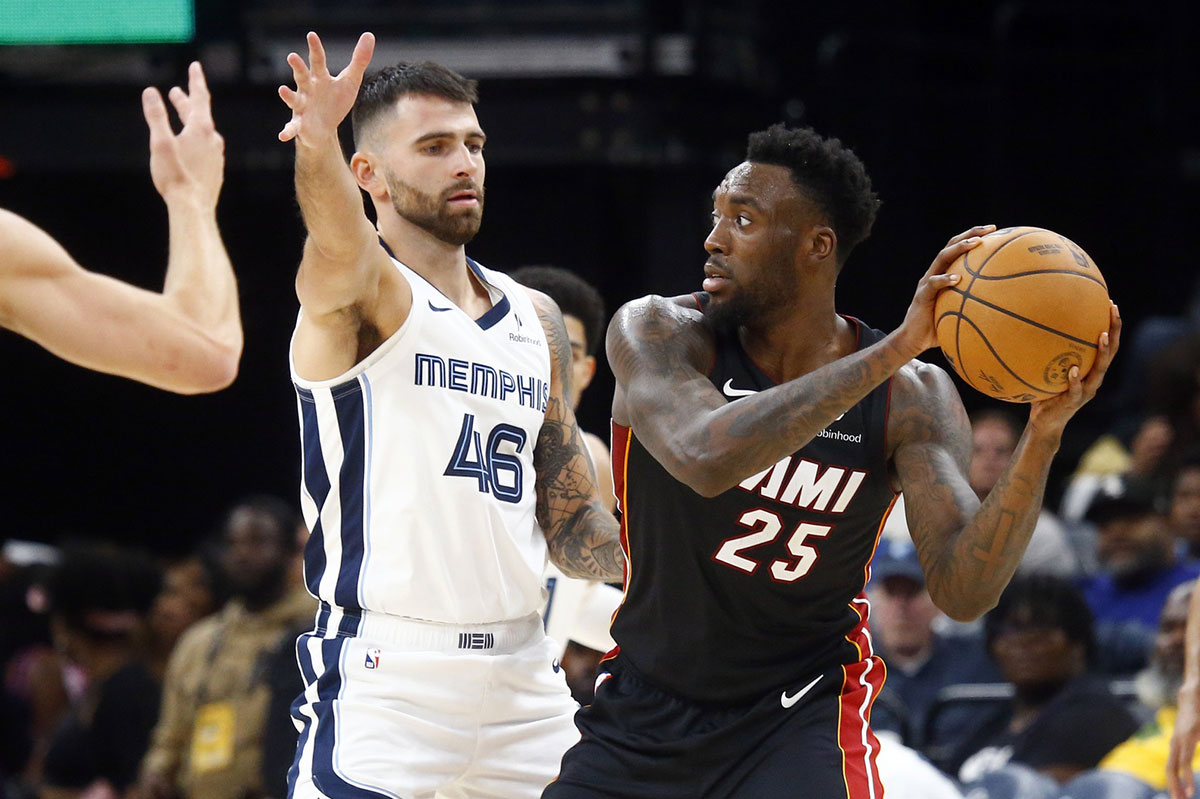 Miami Heat forward Nassir Little (25) handles the ball as Memphis Grizzlies guard John Konchar (46) defends during the second half at FedExForum.