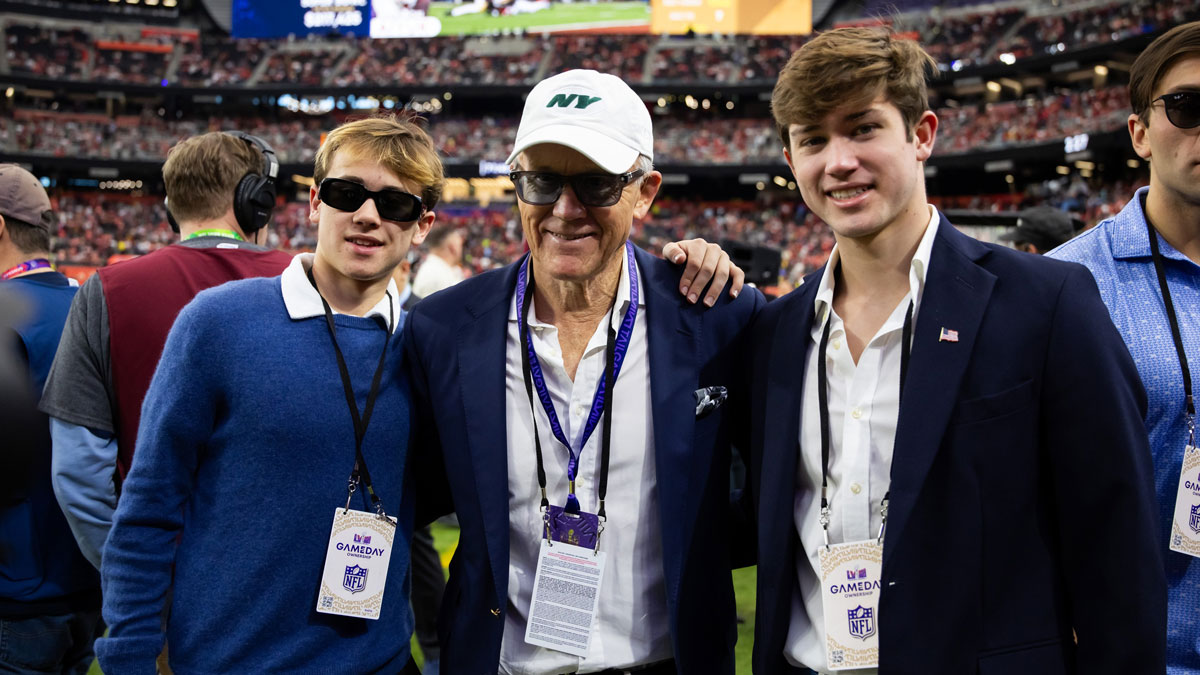 New York Jets owner Woody Johnson on the field with sons Jack Johnson (left) and Brick Johnson before Super Bowl LVIII between the San Francisco 49ers and the Kansas City Chiefs at Allegiant Stadium. 