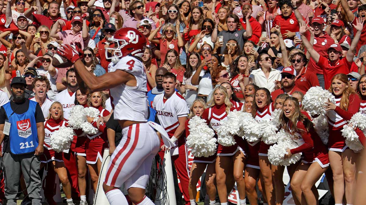 Oklahoma fans watch as Oklahoma Sooners wide receiver Nic Anderson (4) catches a touchdown pass in the final seconds of the Red River Rivalry college football game between the University of Oklahoma Sooners (OU) and the University of Texas (UT) Longhorns at the Cotton Bowl in Dallas, Saturday, Oct. 7, 2023. Oklahoma won 34-30.