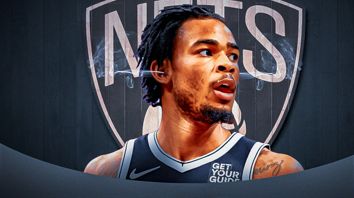 Nic Claxton with steam coming out of his ears and a Nets logo