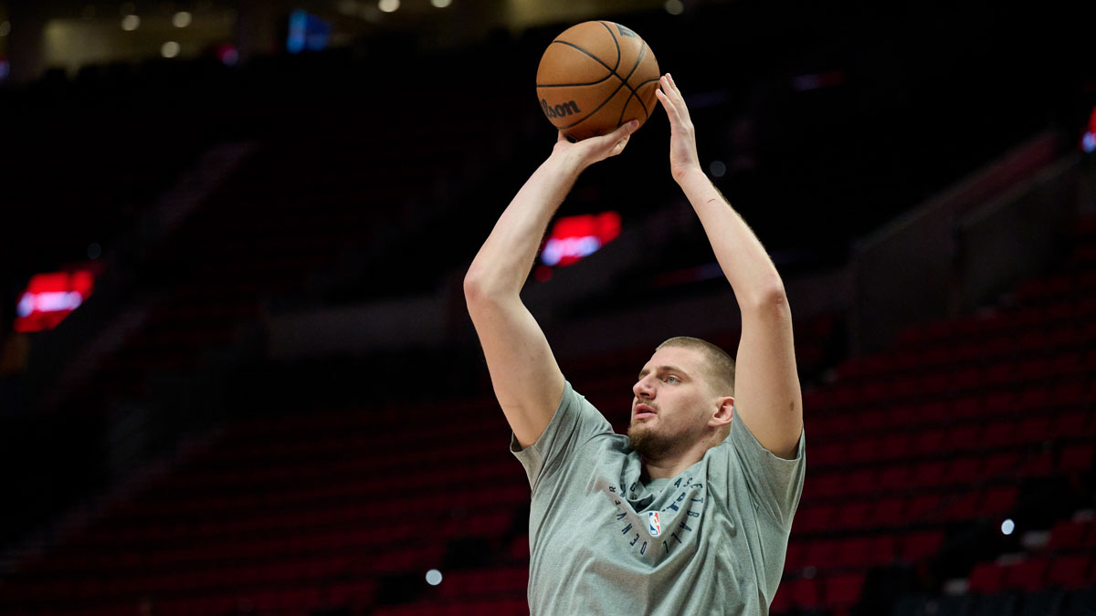 Denver Nuggets center Nikola Jokic (15) warms up before the game against the Portland Trail Blazers at Moda Center.