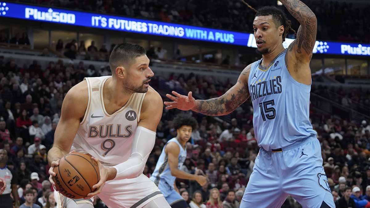 Memphis Grizzlies forward Brandon Clarke (15) defends Chicago Bulls center Nikola Vucevic (9) during the first quarter at United Center.
