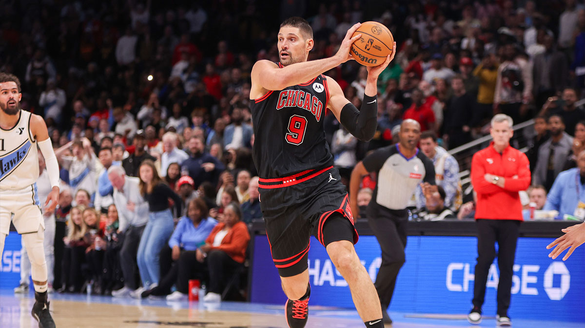 Chicago Bulls center Nikola Vucevic (9) handles the ball against the Atlanta Hawks in the fourth quarter at State Farm Arena. 