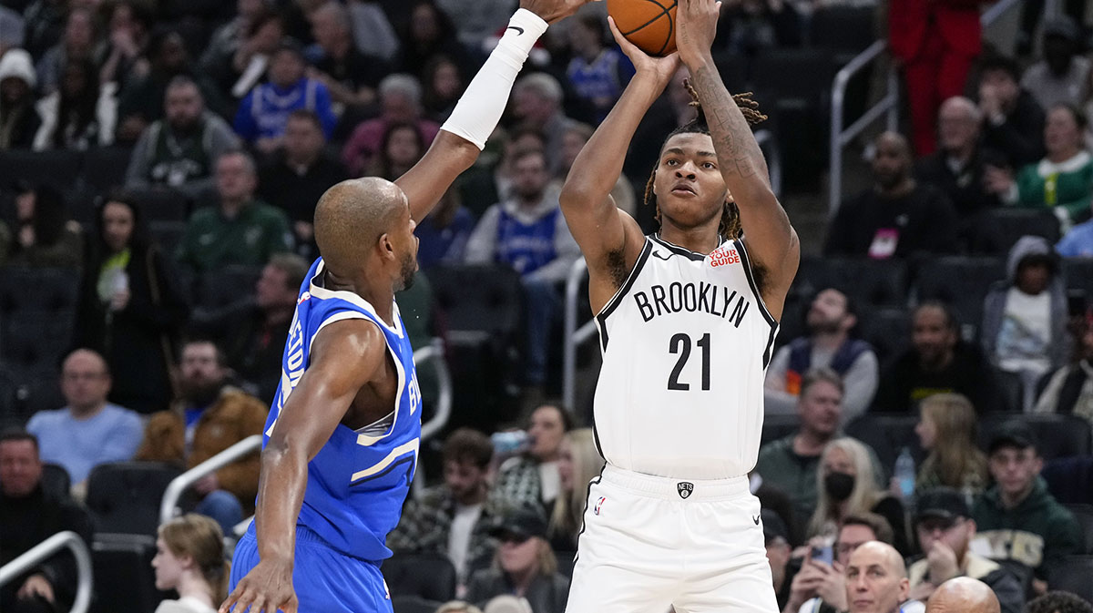 Memphis Grizzlies forward Jaylen Wells (0) shoots the ball against Toronto Raptors guard Gradey Dick (1) during the first quarter at FedExForum.