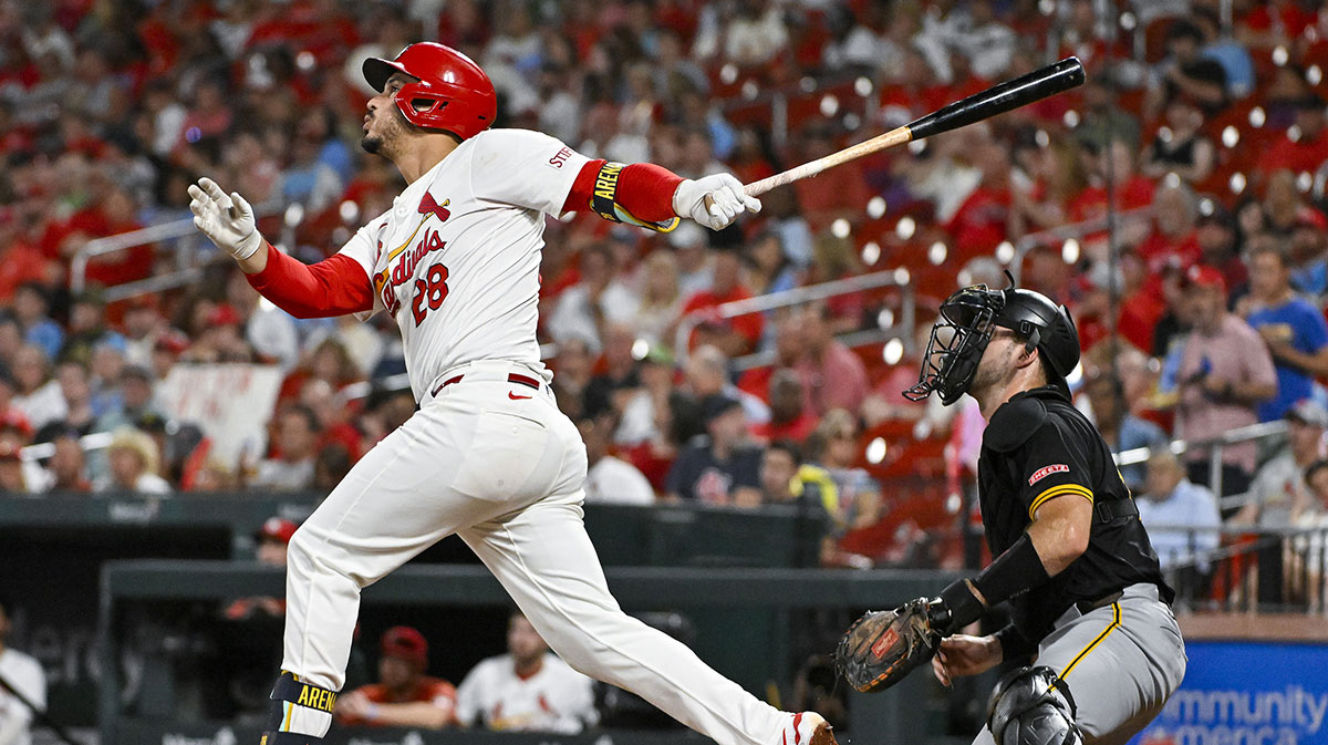  St. Louis Cardinals third baseman Nolan Arenado (28) hits a one run single against the Pittsburgh Pirates during the third inning at Busch Stadium. 