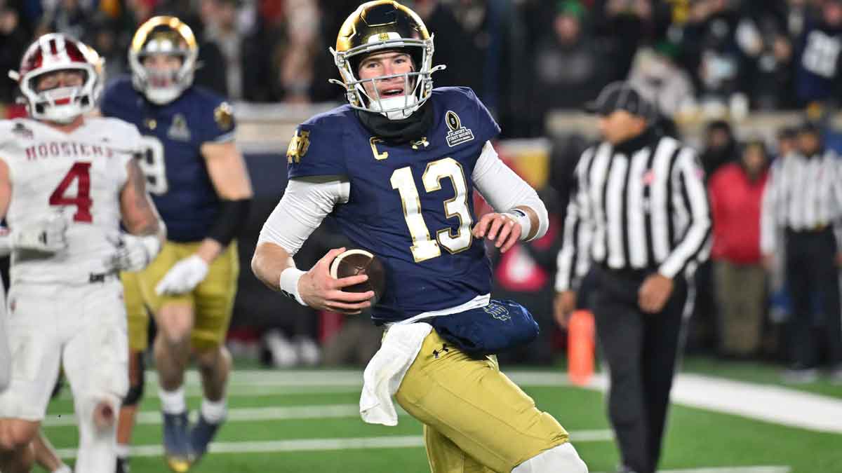 Notre Dame Fighting Irish quarterback Riley Leonard (13) runs for a touchdown during the second half against the Indiana Hoosiers at Notre Dame Stadium.