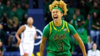 Notre Dame guard Hannah Hidalgo (3) celebrates scoring a three point shot during a NCAA women's basketball game between No. 8 Notre Dame and No. 2 UConn.