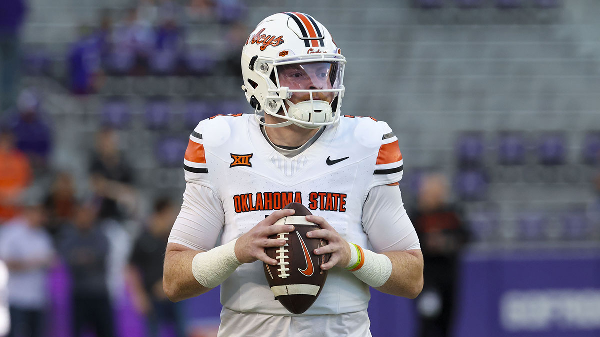 Oklahoma State Cowboys quarterback Alan Bowman (7) warms up before the game against the TCU Horned Frogs at Amon G. Carter Stadium.