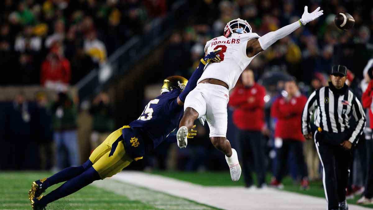 Notre Dame cornerback Leonard Moore (15) interrupts a reception attempt by Indiana wide receiver Omar Cooper Jr. (3) during the first round of the College Football Playoff between Notre Dame and Indiana on Friday, Dec. 20, 2024, in South Bend.