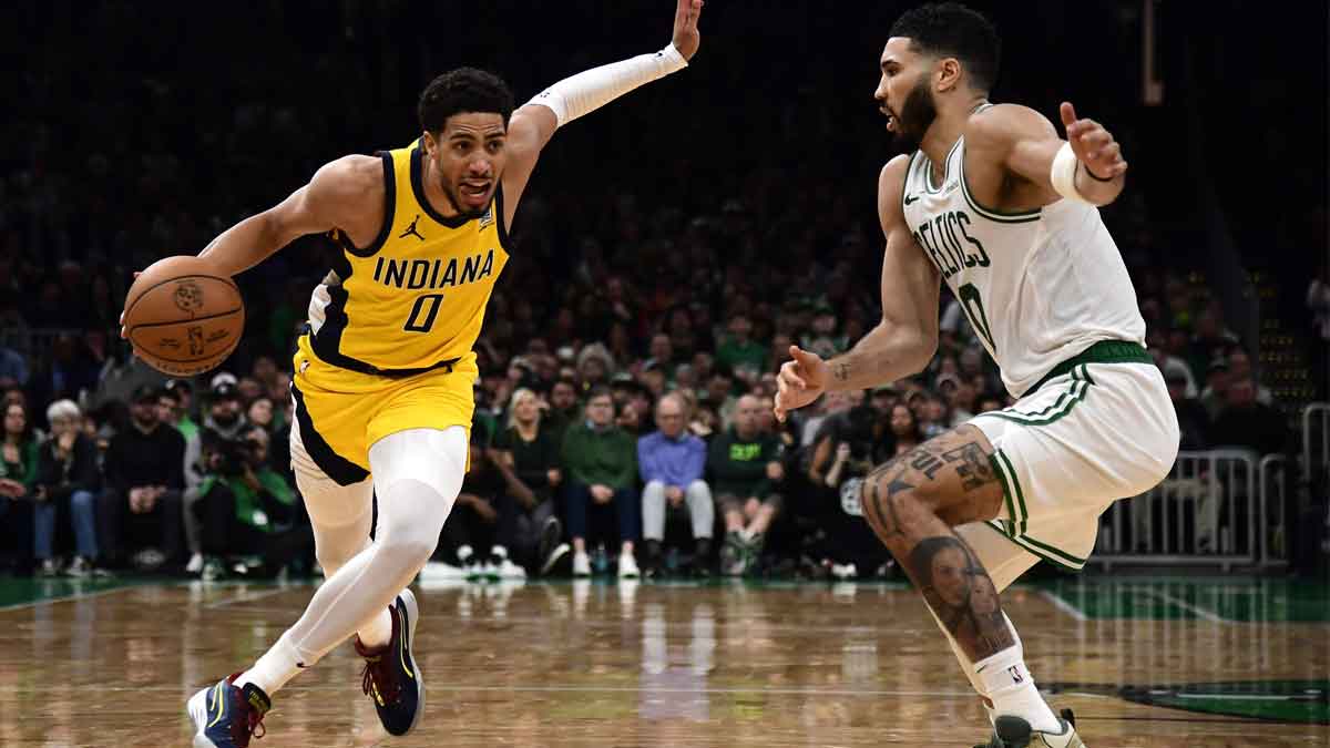Indiana Pacers guard Tyrese Haliburton (0) controls the ball while Boston Celtics forward Jayson Tatum (0) defends during the second half at TD Garden.