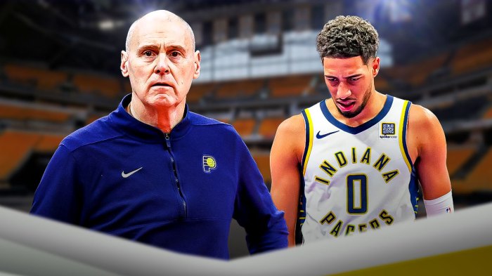 Rick Carlisle looking at Tyrese Haliburton who looks disappointed.