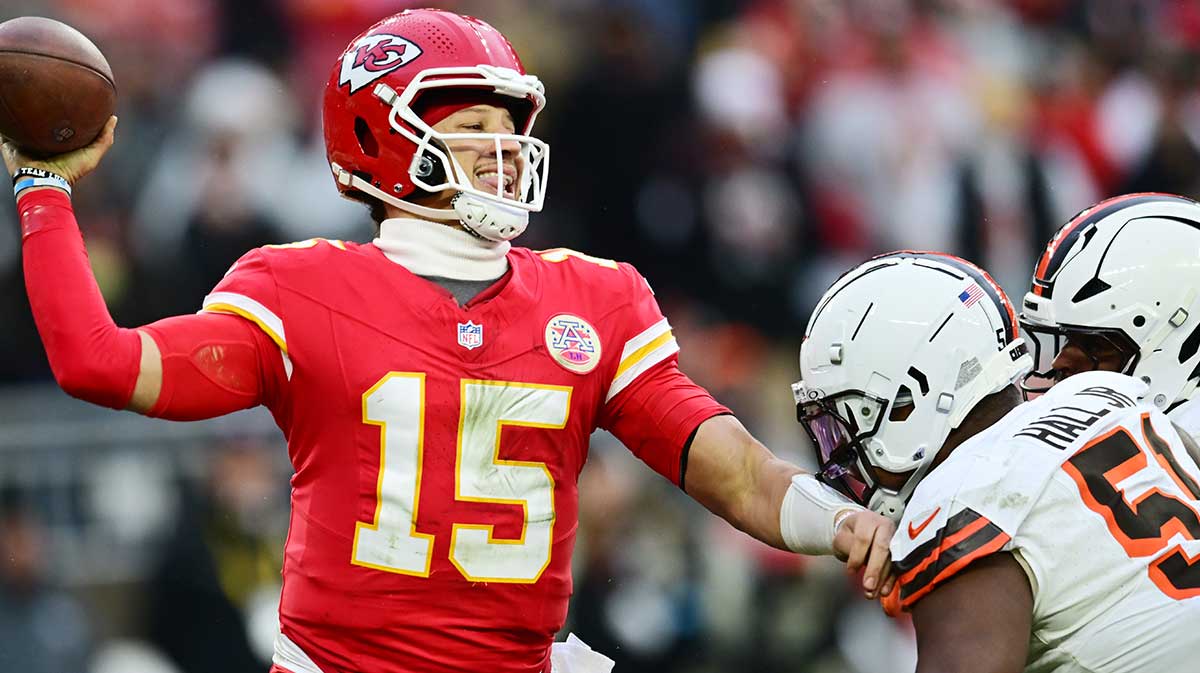 Cleveland Browns defensive tackle Mike Hall Jr. (51) and linebacker Devin Bush (30) rush Kansas City Chiefs quarterback Patrick Mahomes (15) during the second half at Huntington Bank Field.