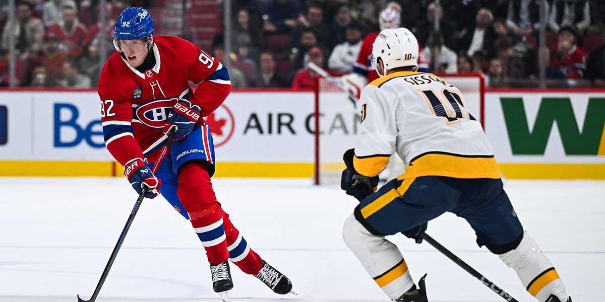 Montreal Canadiens right wing Patrik Laine (92) plays the puck against Nashville Predators center Colton Sissons (10) during the second period at Bell Centre.