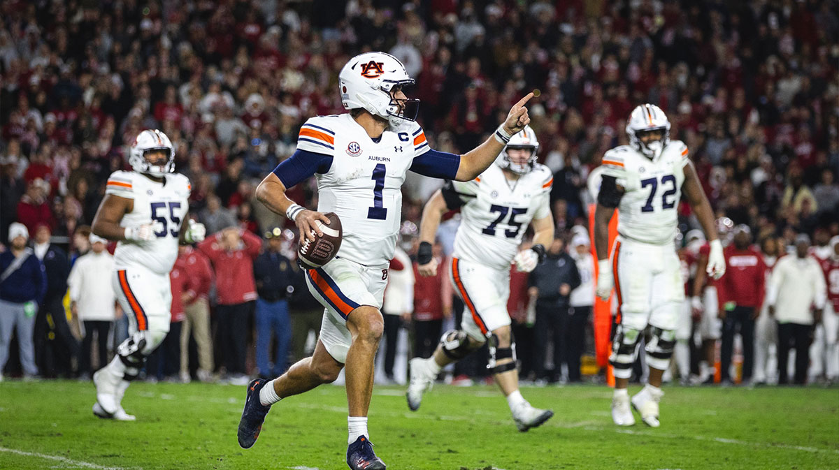 November 30, 2024; Tuscaloosa, Alabama, United States; Auburn Tigers quarterback Payton Thorne (1) runs the ball against the Alabama Crimson Tide during the fourth quarter at Bryant-Denny Stadium.