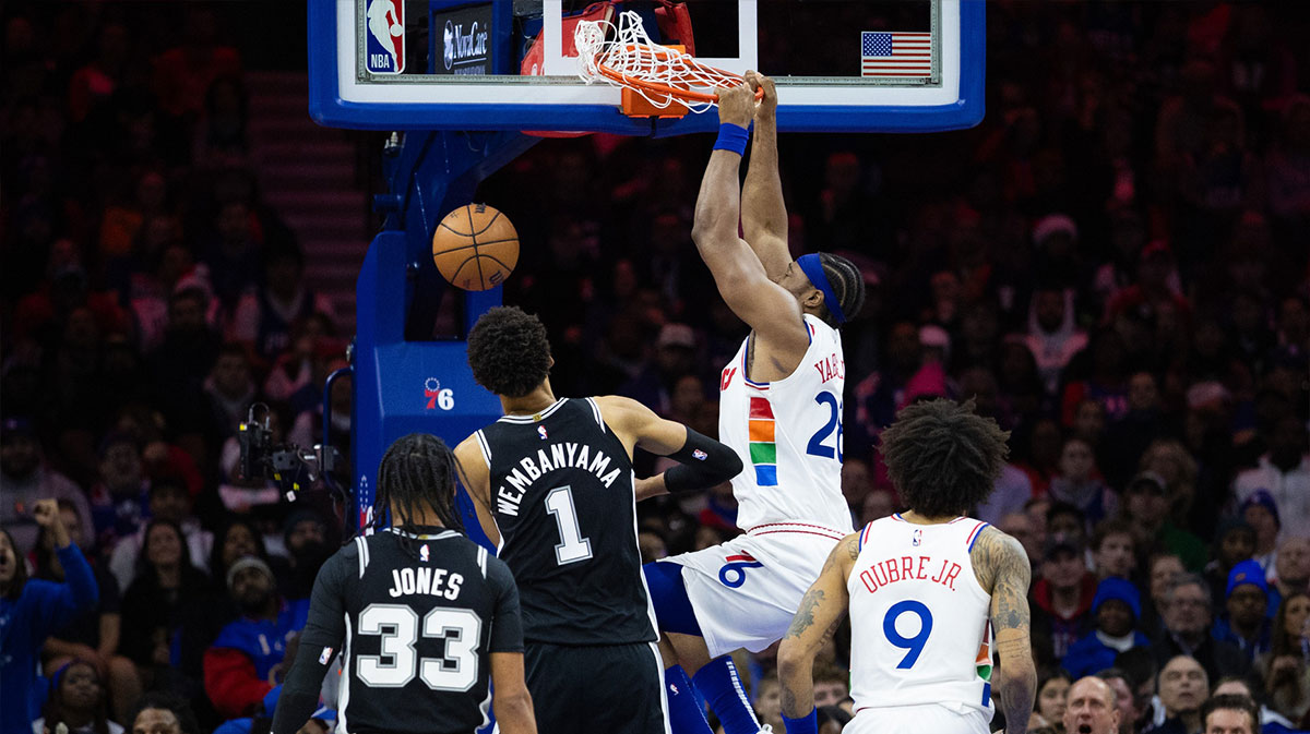 Philadelphia 76ers forward Guerschon Yabusele (28) dunks the ball in front of San Antonio Spurs center Victor Wembanyama (1) during the fourth quarter at Wells Fargo Center.
