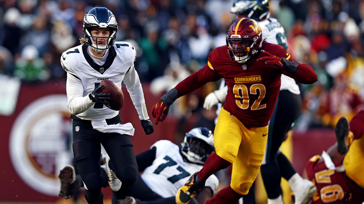 Philadelphia Eagles quarterback Kenny Pickett (7) runs the ball against Washington Commanders defensive end Dorance Armstrong (92) during the third quarter at Northwest Stadium.