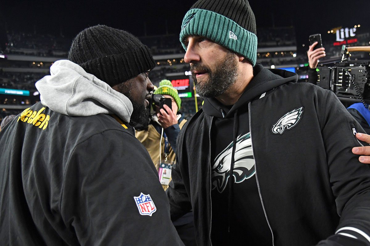 Pittsburgh Steelers head coach Mike Tomlin and Philadelphia Eagles head coach Nick Sirianni meet on the field after game at Lincoln Financial Field.