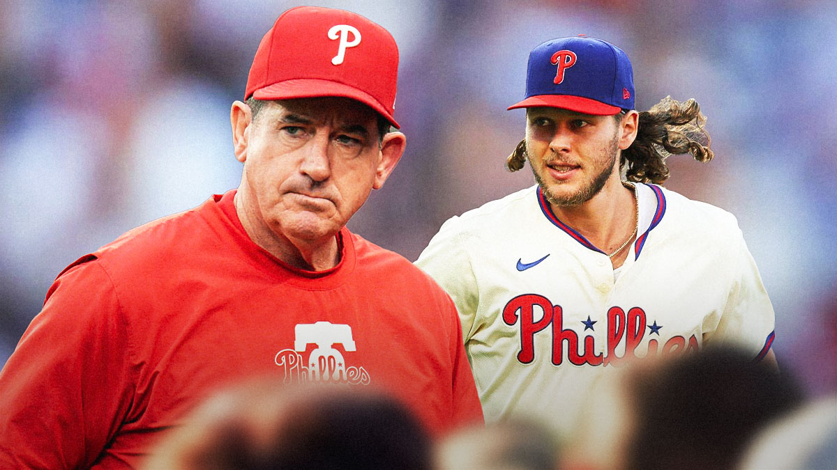 Phillies' Rob Thomson holding on to Alec Bohm, with caption: HE'S OURS