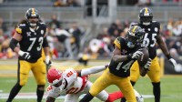 Pittsburgh Steelers wide receiver George Pickens (14) runs after a catch past Kansas City Chiefs cornerback Joshua Williams (2) during the fourth quarter at Acrisure Stadium.